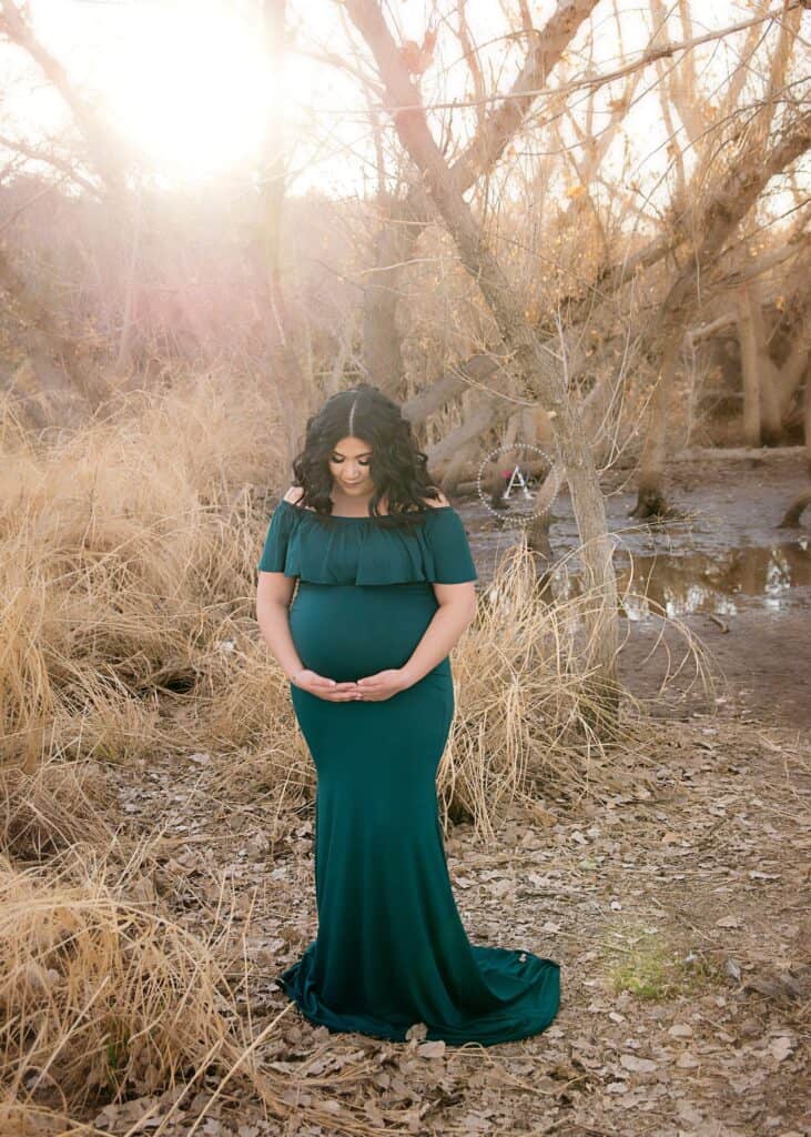 Outdoor maternity photoshoot with mom at sunset.