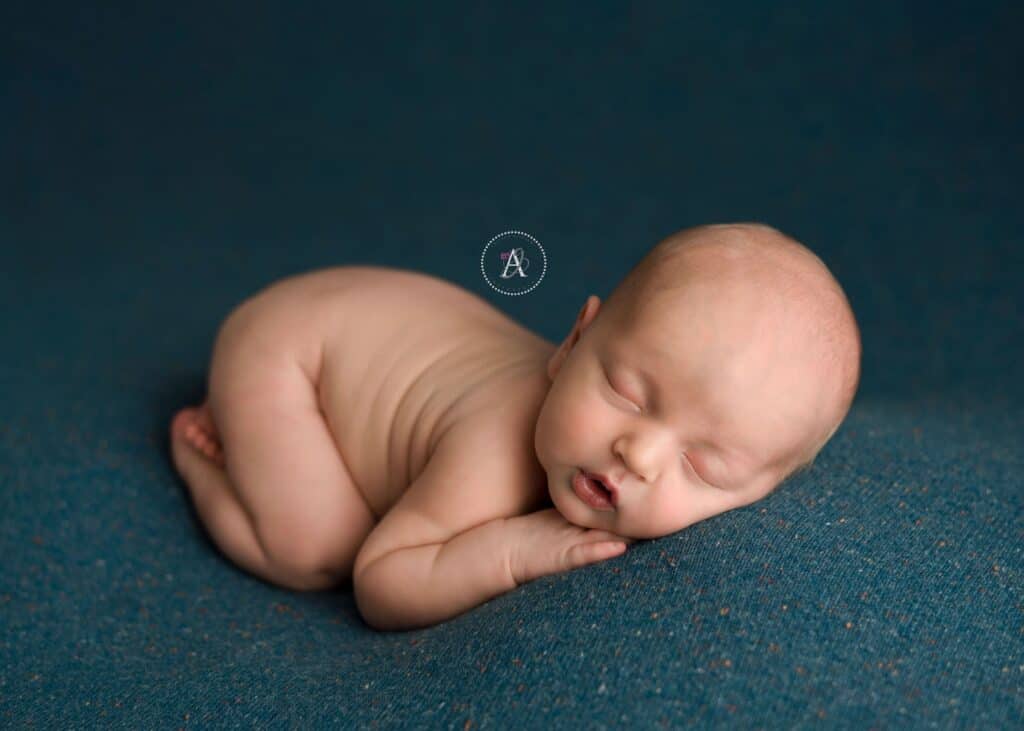 In studio Arizona professional newborn photoshoot with props and colors.